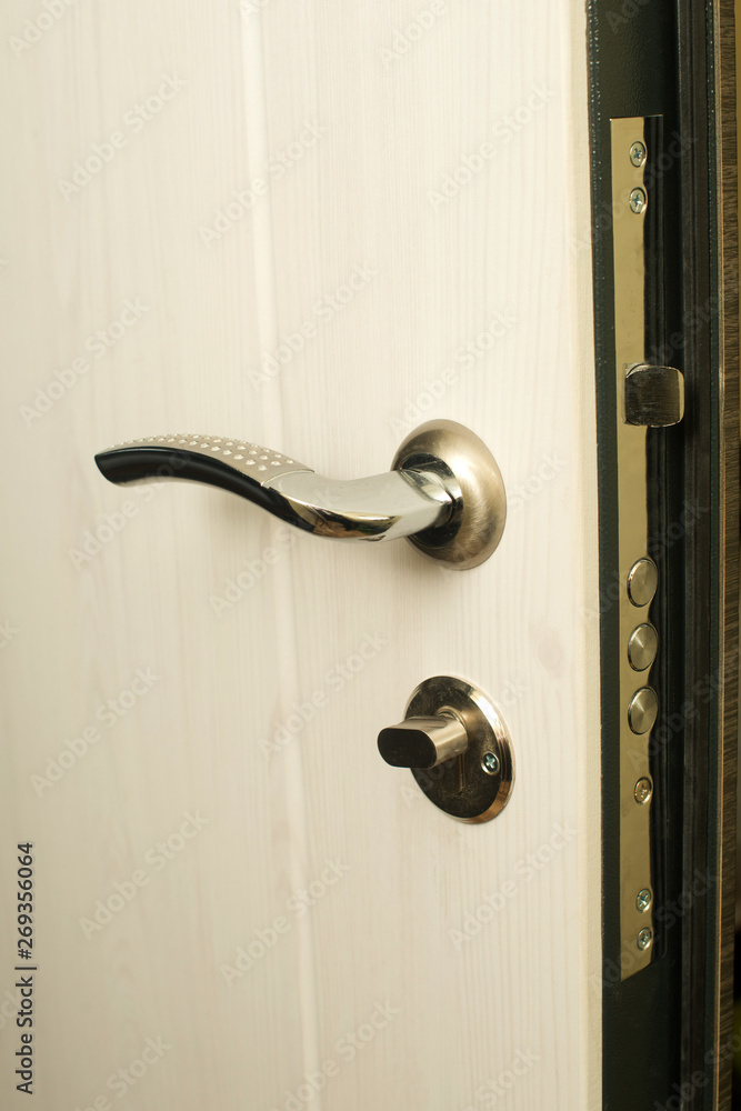 door lock closeup. steel doors. key in the door lock door lock closeup. steel doors. key in the door lock