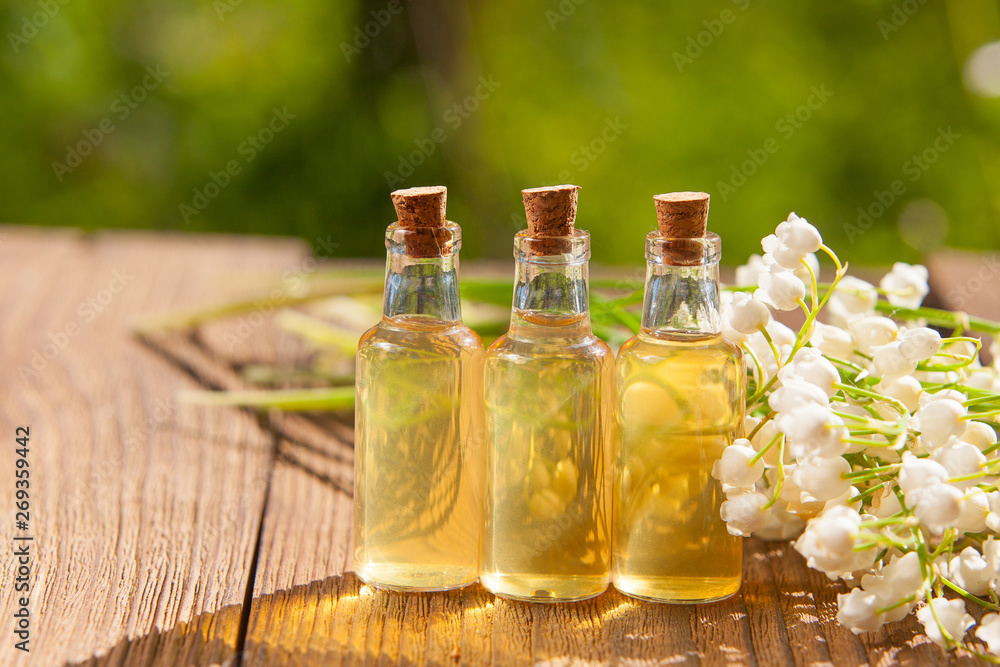 Essence of flowers on table in beautiful glass jar Essence of flowers on table in beautiful glass jar