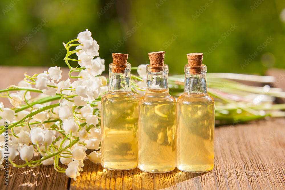 Essence of flowers on table in beautiful glass jar Essence of flowers on table in beautiful glass jar