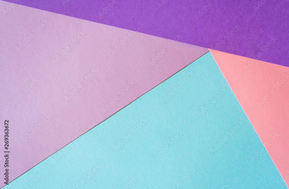 Multicolored paper background in soft blue, violet, lilac and coral colors. Multicolored paper background in soft blue, violet, lilac and coral colors.