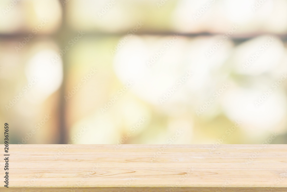 Empty wooden table top with green garden at cafe restaurant or coffee shop window abstract blur defocused with bokeh light background for montage product display Empty wooden table top with green garden at cafe restaurant or coffee shop window abstract blur defocused with bokeh light background for montage product display