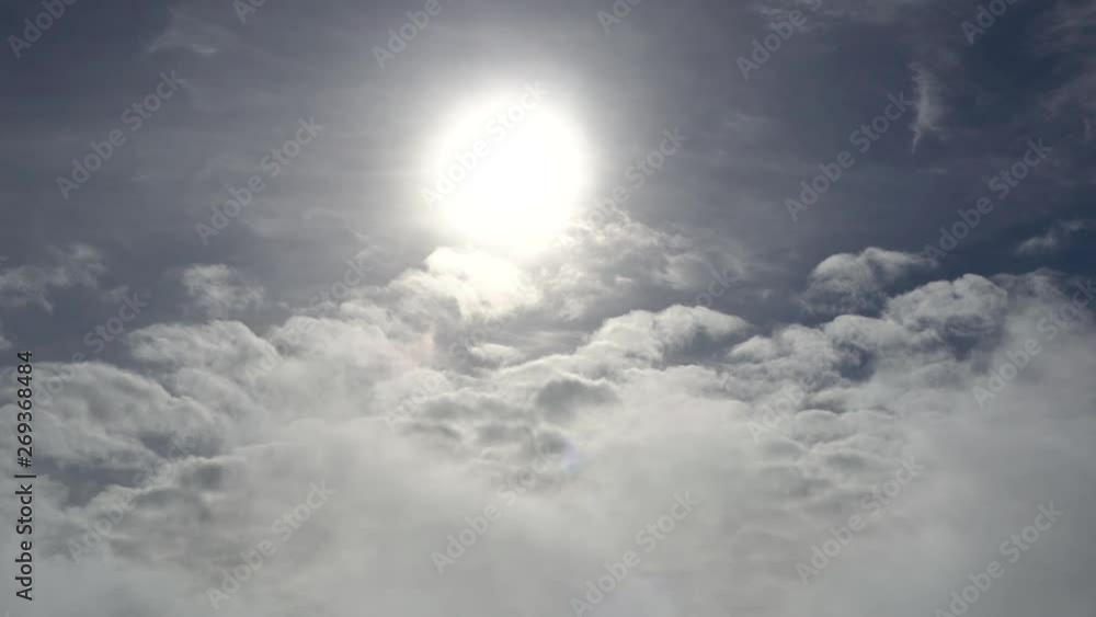 Steady of sun shining surrounded by clouds on blue sky background day Steady of sun shining surrounded by clouds on blue sky background day
