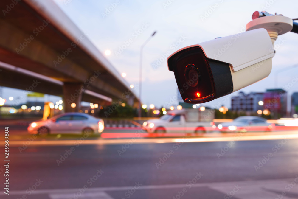 CCTV surveillance camera operating on traffic road CCTV surveillance camera operating on traffic road