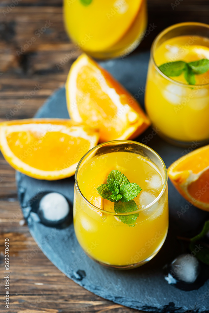 Fototapeta premium Fresh summer cocktail with orange and mint