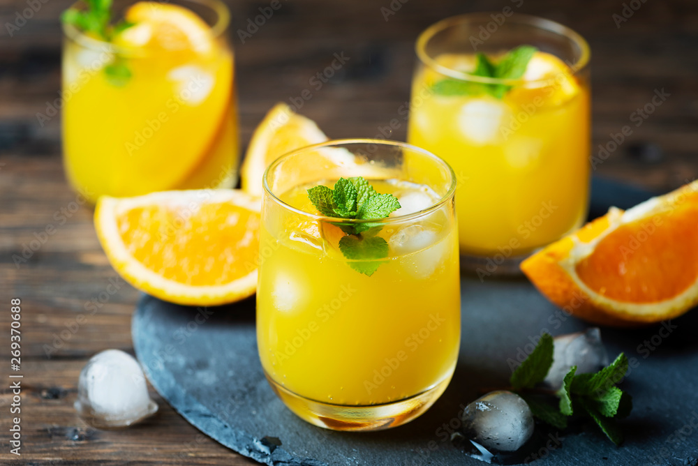 Fresh summer cocktail with orange and mint Fresh summer cocktail with orange and mint
