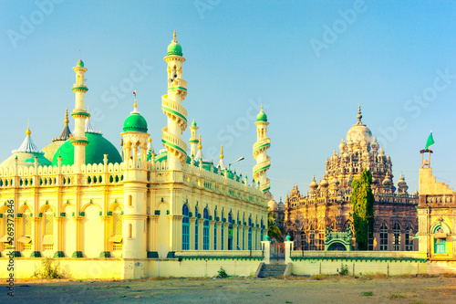 Towering minarets with winding staircases of Jama Masjid and Mahabat Maqbara Palace (Bahauddin Maqbara) - beautiful medieval islamic architecture of Junagadh. Gujarat, India photo