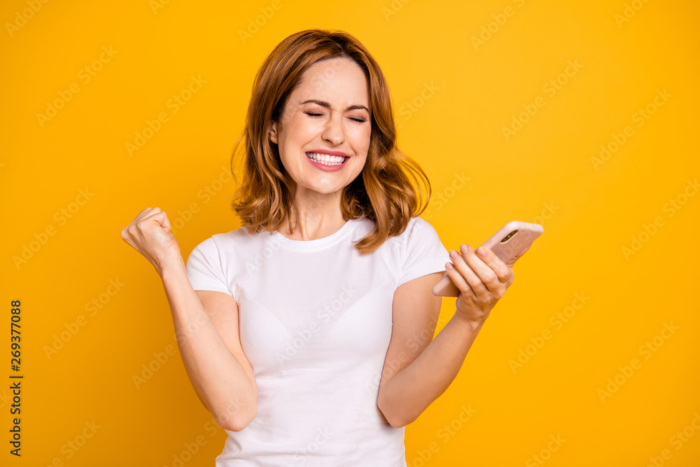 Portrait of funny funky charming delighted ecstatic lady raise fists close yes scream shout yeah successful achievement aim goals have luck fortune dressed fashionable youth clothes isolated yellow Portrait of funny funky charming delighted ecstatic lady raise fists close yes scream shout yeah successful achievement aim goals have luck fortune dressed fashionable youth clothes isolated yellow