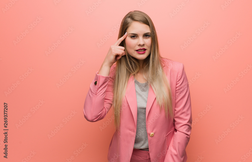 Young russian woman wearing pajama doing a disappointment gesture with finger Young russian woman wearing pajama doing a disappointment gesture with finger