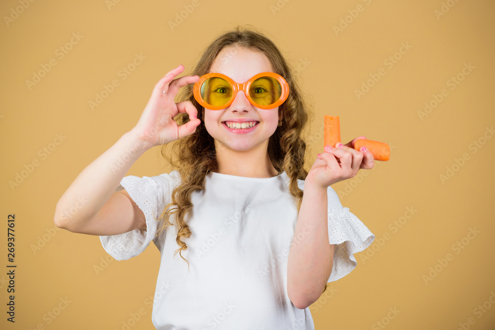 Natural vitamin source. Girl eat carrot vegetable and drink carrot juice. Vitamin nutrition. Fashion kid sunglasses drink refreshing vitamin juice. Health care. Summer vitamin diet. Happy childhood Natural vitamin source. Girl eat carrot vegetable and drink carrot juice. Vitamin nutrition. Fashion kid sunglasses drink refreshing vitamin juice. Health care. Summer vitamin diet. Happy childhood