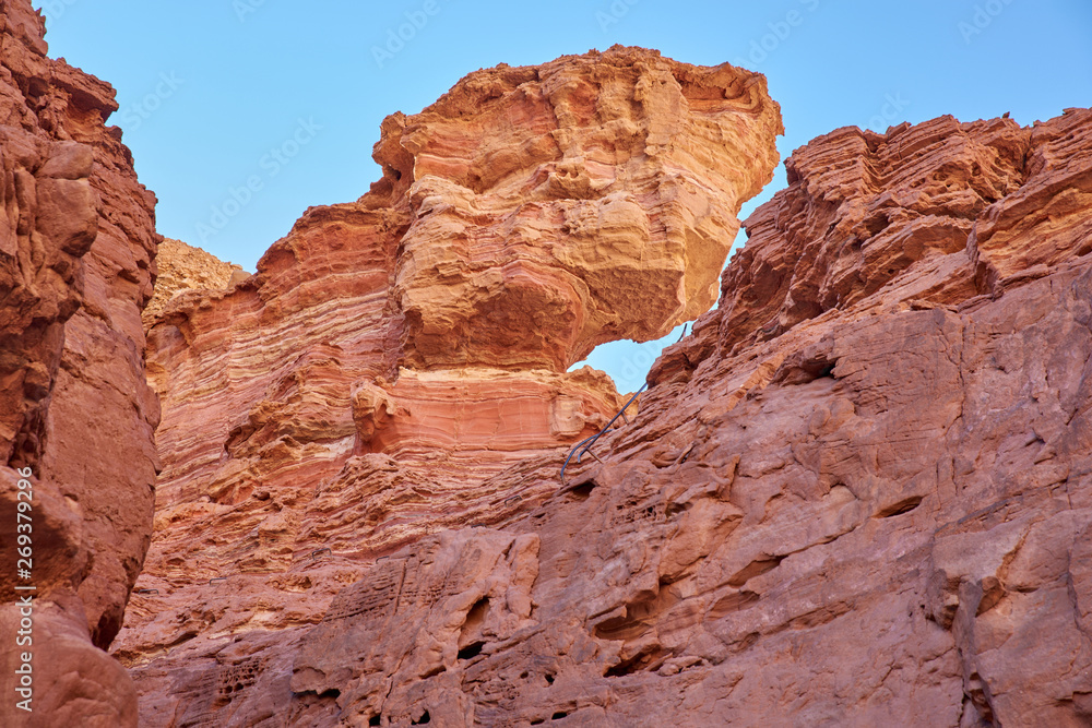Israel. The neighborhood of Eilat. Red canyon. Upstairs staples and access stairs to the upper reverse path Israel. The neighborhood of Eilat. Red canyon. Upstairs staples and access stairs to the upper reverse path
