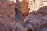Israel. The neighborhood of Eilat. Red canyon. The bottom of the narrow cleft