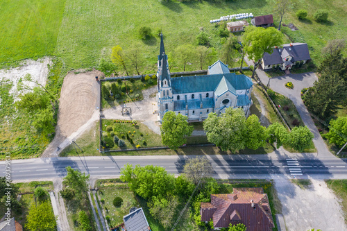 Aerial photo of a Catholic Church. Green. Spring time