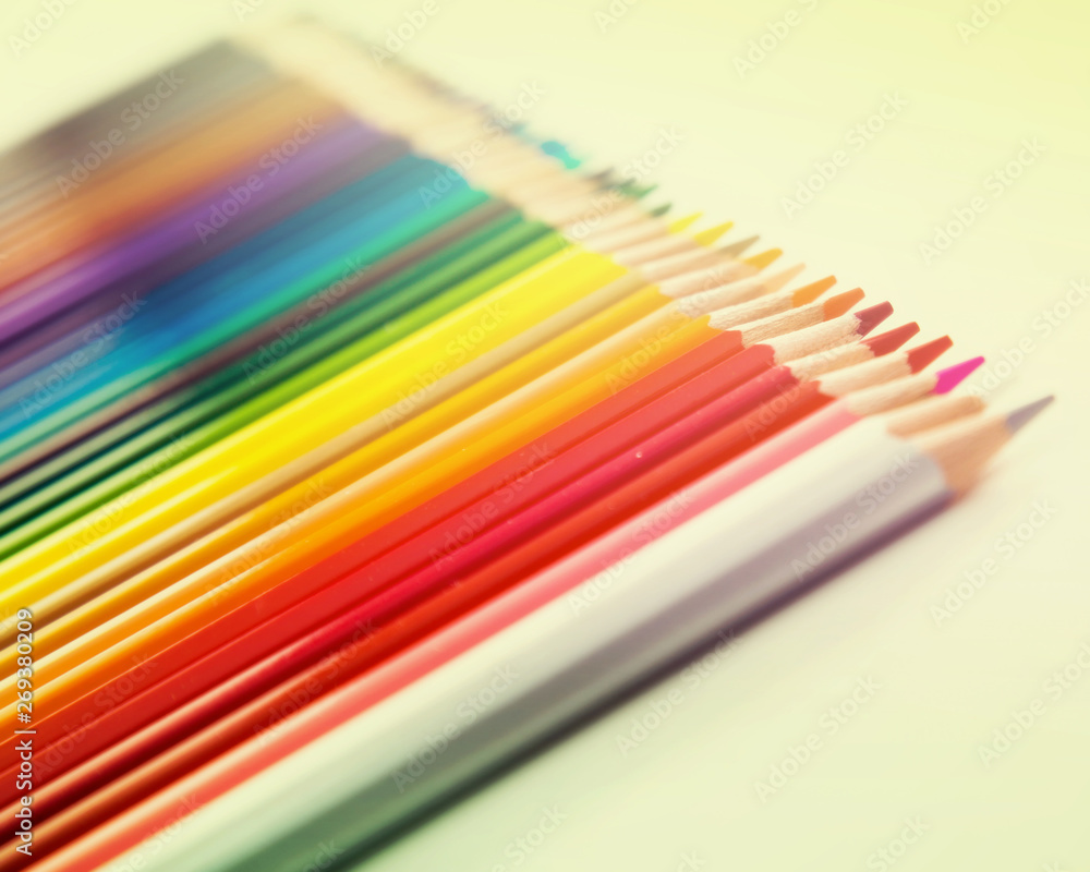 colored pencils lying in row colored pencils lying in row