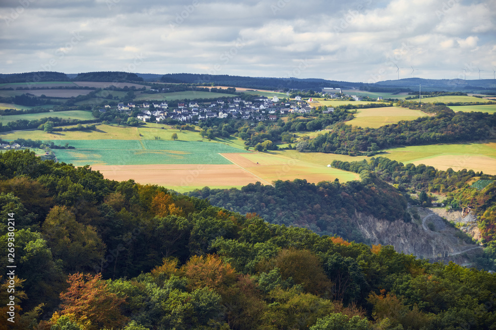 View to hills and fields of Rheinland-Pfalz state with village from tourist route on Hessen state