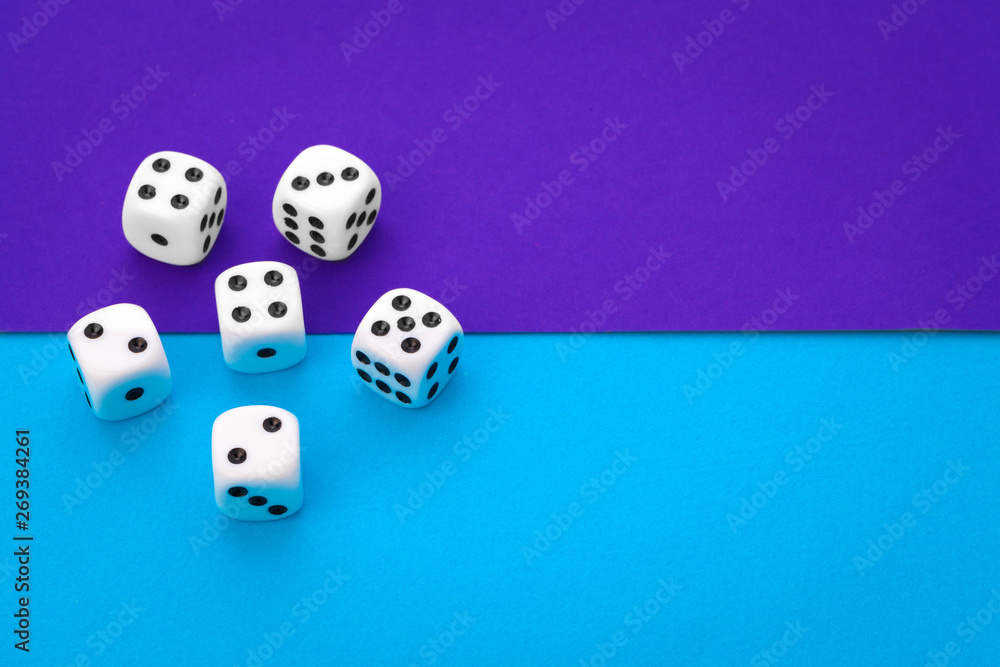 White dices against a blue background White dices against a blue background