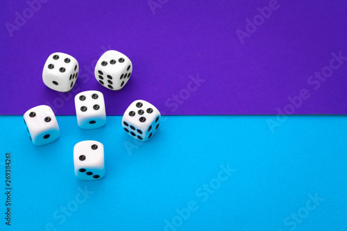 White dices against a blue background