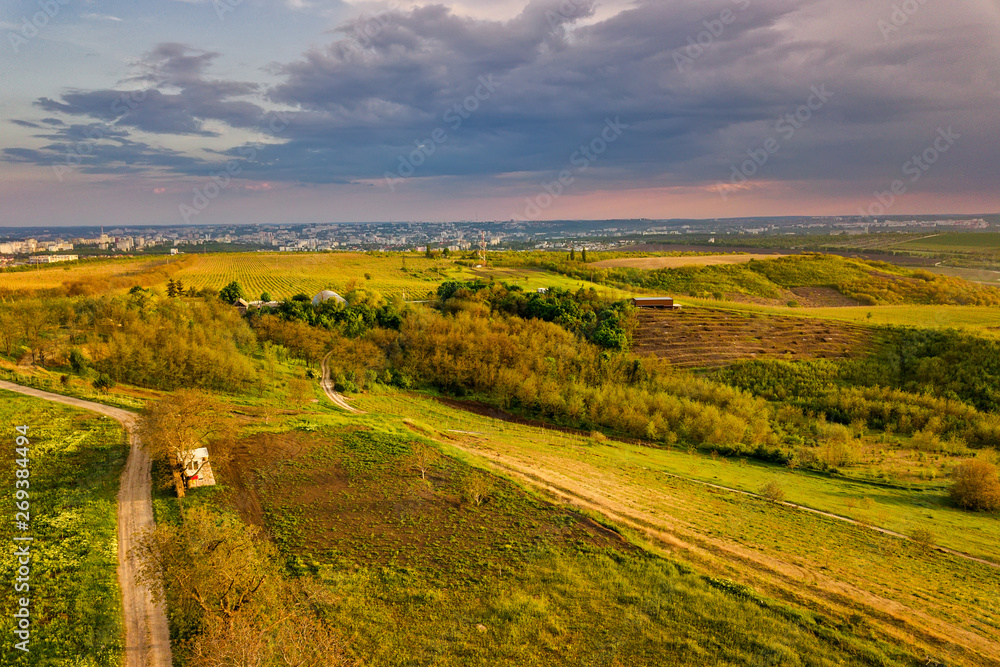 Flight over cultivating field in the spring at sunset. Moldova Republic of.