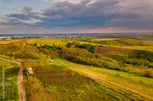 Flight over cultivating field in the spring at sunset. Moldova Republic of.