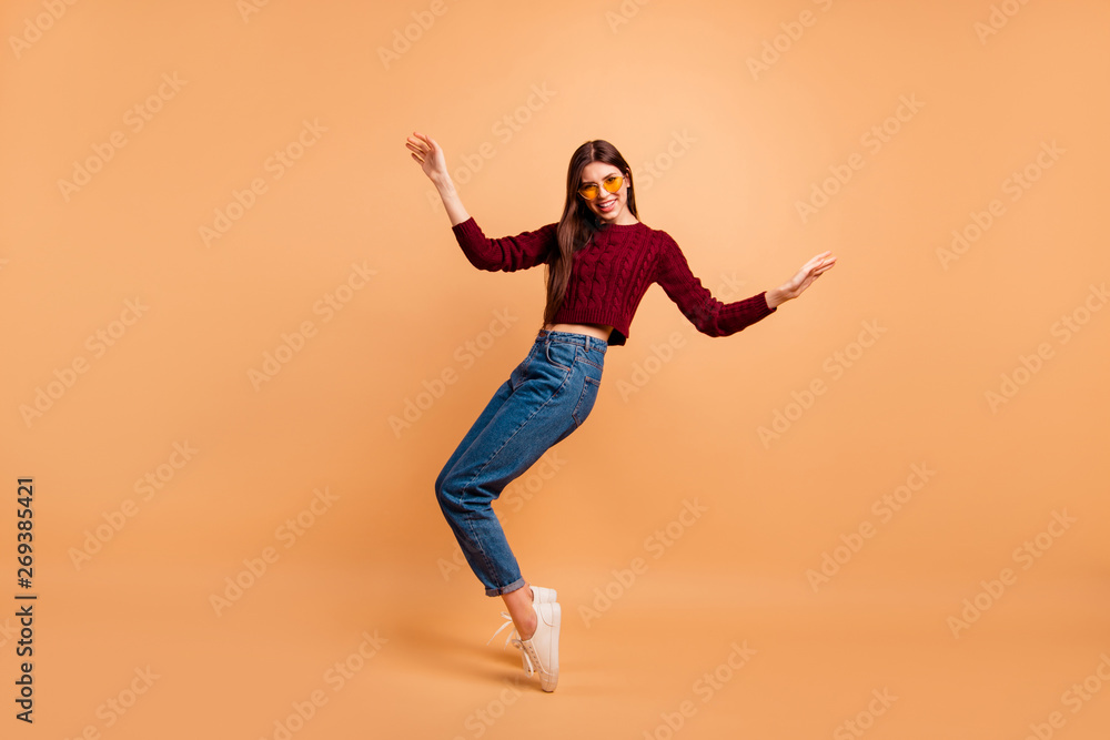 Full length side profile body size photo beautiful she her lady ideal appearance look dancing star queen hands arms raised wear casual red burgundy knitted pullover isolated pastel beige background Full length side profile body size photo beautiful she her lady ideal appearance look dancing star queen hands arms raised wear casual red burgundy knitted pullover isolated pastel beige background
