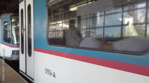 Manila MRT arriving and passing by inside the train station