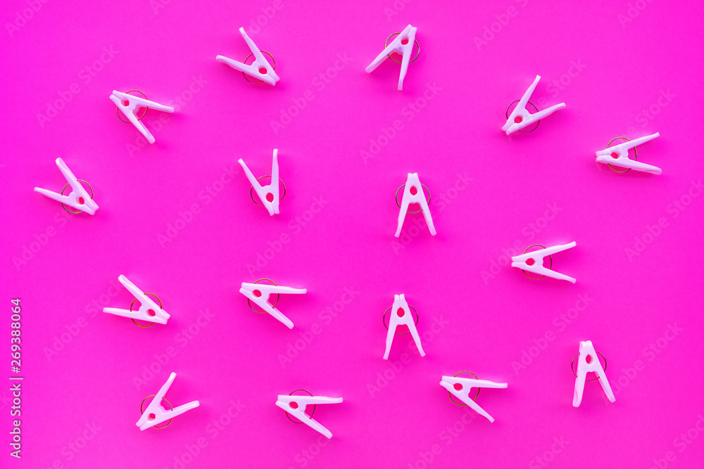 clothespins on pastel color background