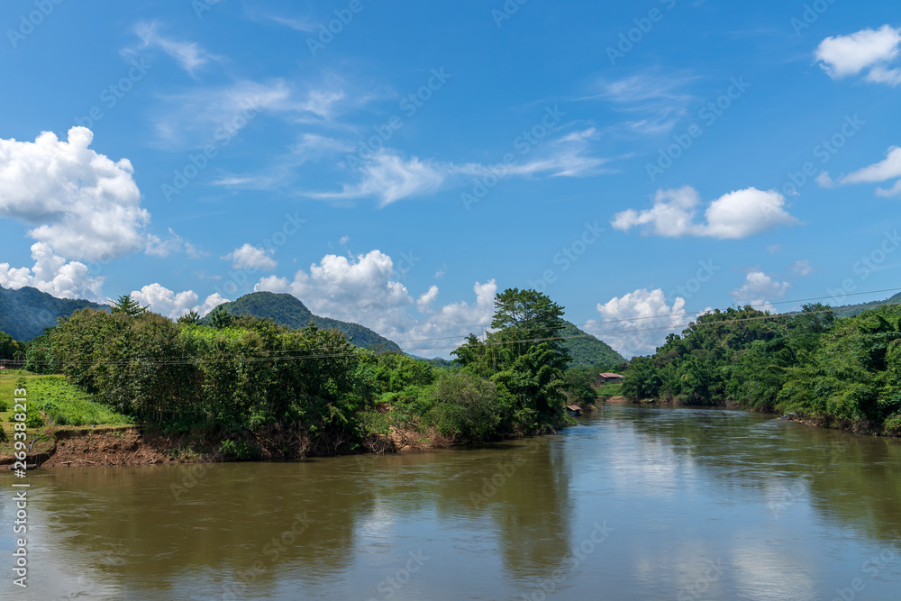 Blue sky high peak mountains fog hills mist scenery river lake dam bay gulf wildlife National park views Kanchanaburi, Thailand. Blue sky high peak mountains fog hills mist scenery river lake dam bay gulf wildlife National park views Kanchanaburi, Thailand.