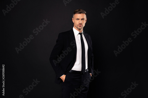 Portrait of his he nice-looking attractive chic gorgeous content guy financier executive director economist auditor attorney lawyer ceo boss chief isolated over dark black background