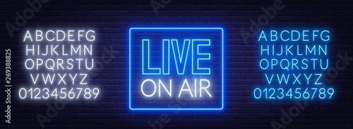 Live on air glowing sign on brick wall background. Template for design. Neon alphabet .