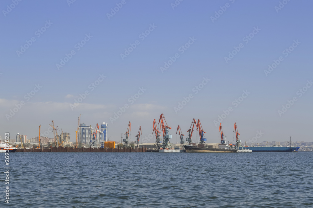 construction in the Caspian sea with Baku cityscape construction in the Caspian sea with Baku cityscape