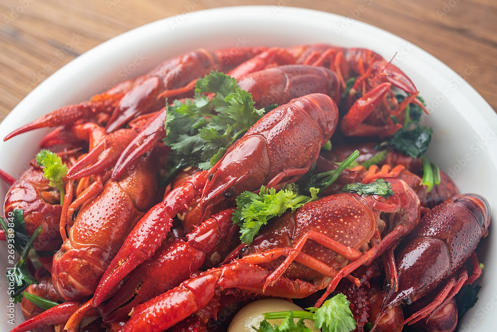 Chinese dish with a bowl of bright red delicious spicy crayfish Chinese dish with a bowl of bright red delicious spicy crayfish