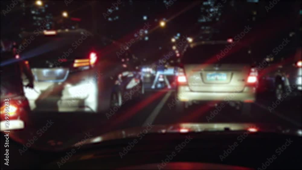 Car stuck in traffic at night while raining in Manila Car stuck in traffic at night while raining in Manila