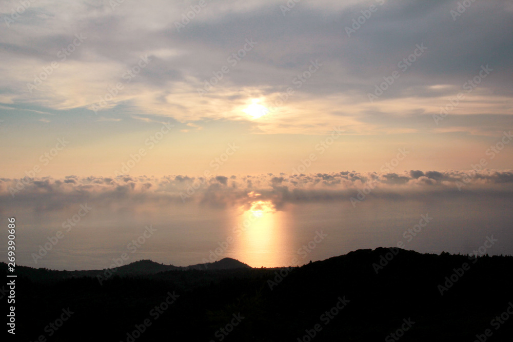 Fototapeta premium Sea, sky, beautiful structure of clouds, majestic landscape with seascape at calm sunset on horizon of mediterranean coast. Amazing sunset vibes on edge ocean. Sunrise over sea, natural environment.