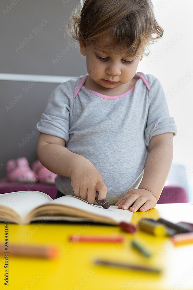 toddler girl drawing with crayons on paper toddler girl drawing with crayons on paper