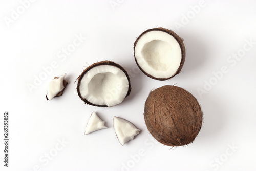 broken coconut on a white background top view.