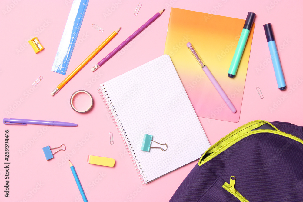 School stationery and school backpack on a colored background top view. concept: back to school School stationery and school backpack on a colored background top view. concept: back to school