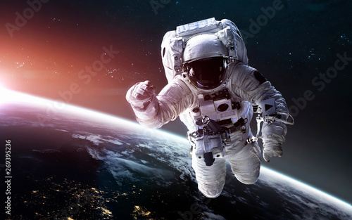Fototapeta Naklejka Na Ścianę i Meble -  Look on our planet from orbital international space station ISS, astronaut at spacewalk. Elements of this image furnished by NASA