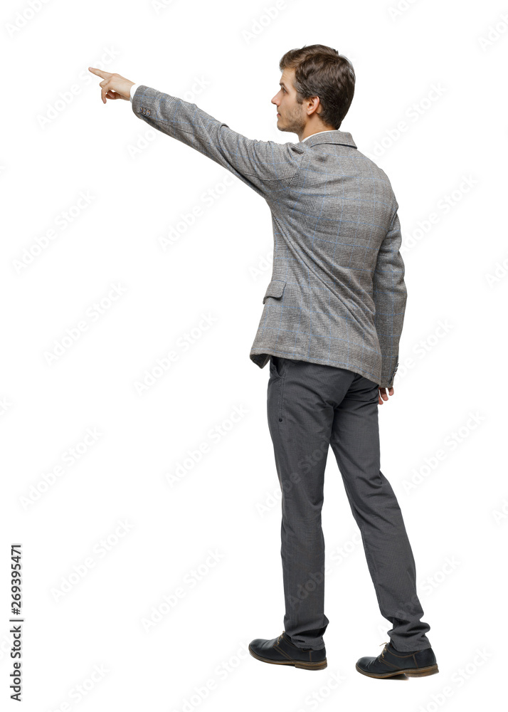 Back view of walking pointing business man. Back view of walking pointing business man.