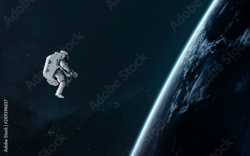 Valokuva Astronaut orbiting Earth planet, EVA, science fiction image