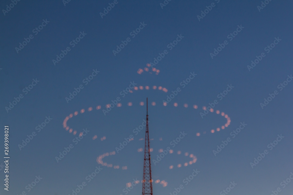 Obraz premium Chandelier Light Reflections on City Antenna Tower. UFO Concept. Abstract Geometric Background.