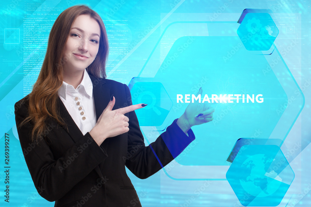 The concept of business, technology, the Internet and the network. A young entrepreneur working on a virtual screen of the future and sees the inscription: Remarketing The concept of business, technology, the Internet and the network. A young entrepreneur working on a virtual screen of the future and sees the inscription: Remarketing