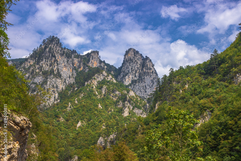 Mountain landscape in the summer cloudy day. Soft focus and blurred background. Mountain landscape in the summer cloudy day. Soft focus and blurred background.