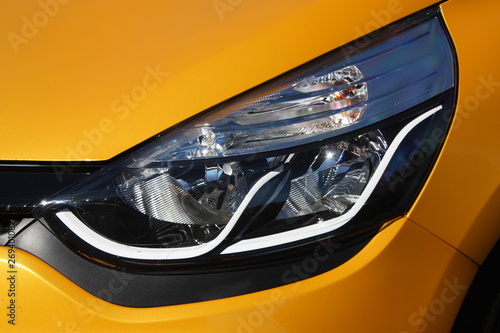 Yellow hot hatchback headlight