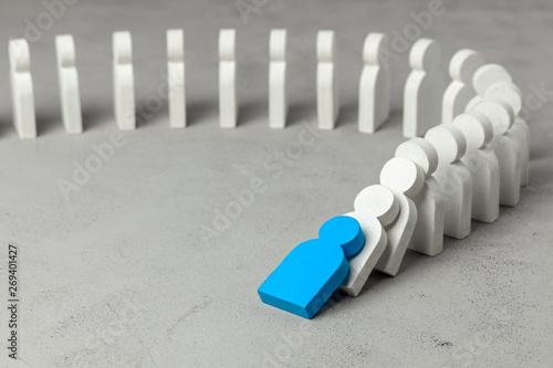Domino effect in business. One businessman leader falls and brings down other figures of employees. System disruption.