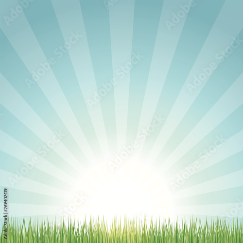 Sun rising above lawn background