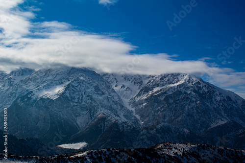 snow on the mountain and clouds 