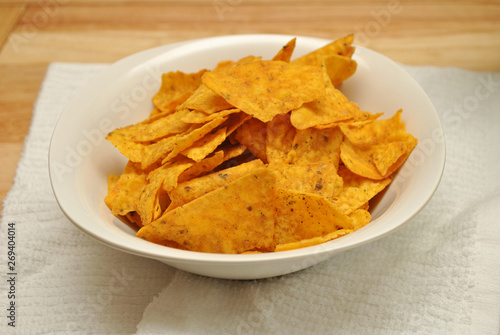 Cheesy Tortilla Chips Served in a White Bowl 