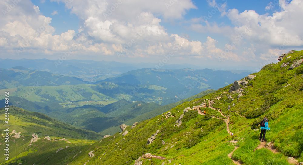 Fototapeta premium Hiking with a tent through Petros to Hoverla, Lake Nesamovite, Mount Pop Ivan Observatory.