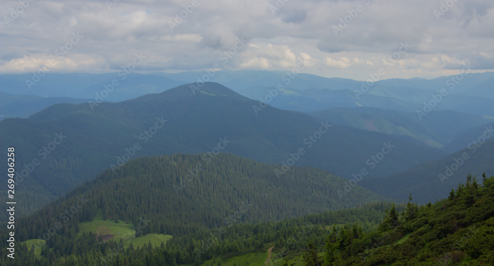 Fototapeta premium Hiking with a tent through Petros to Hoverla, Lake Nesamovite, Mount Pop Ivan Observatory.