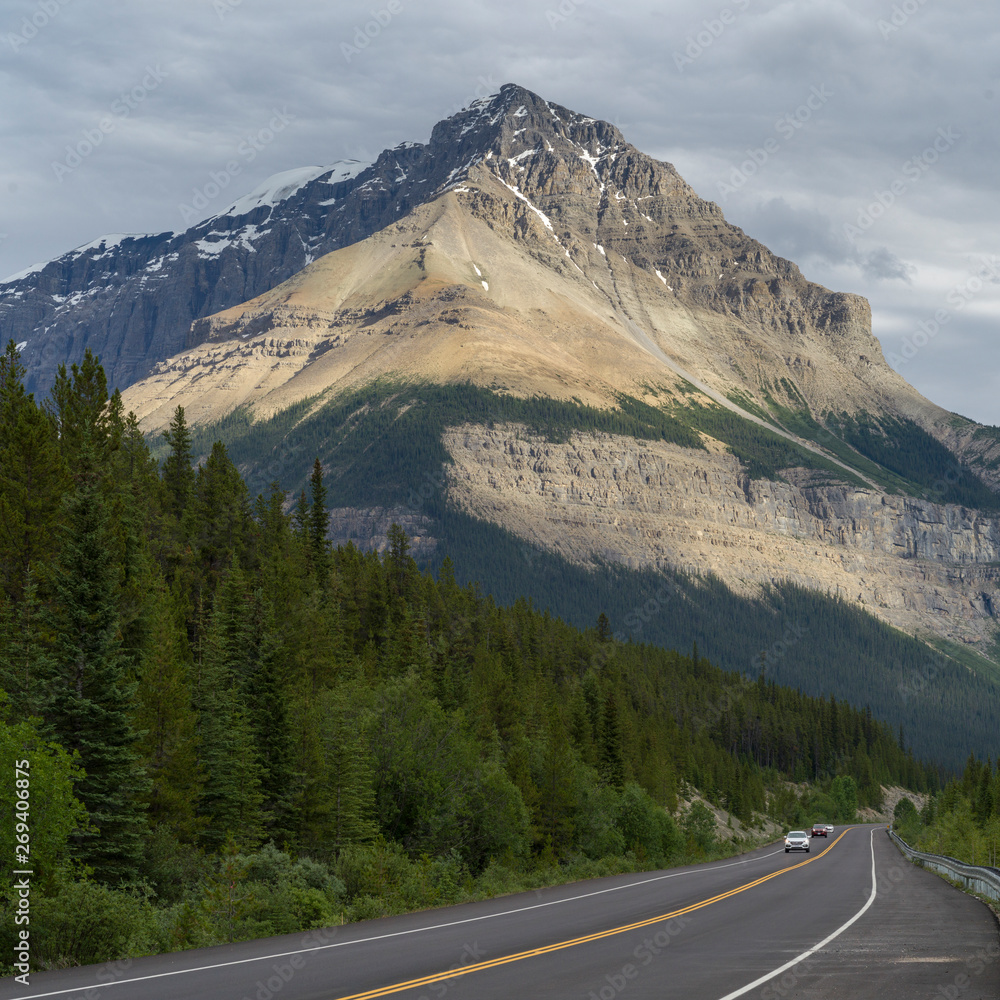 Sunlight on mountain peak, seen from Icefields Parkway, Jasper, Alberta, Canada Sunlight on mountain peak, seen from Icefields Parkway, Jasper, Alberta, Canada