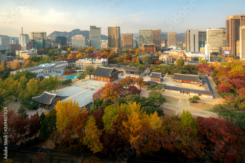 Deoksugung Palace and Seoul city in autumn season in Seoul, South Korea.